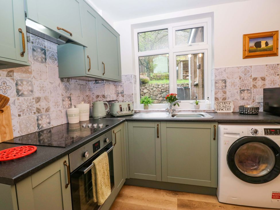 A kitchen with cabinets and appliances at Dakota in Boot