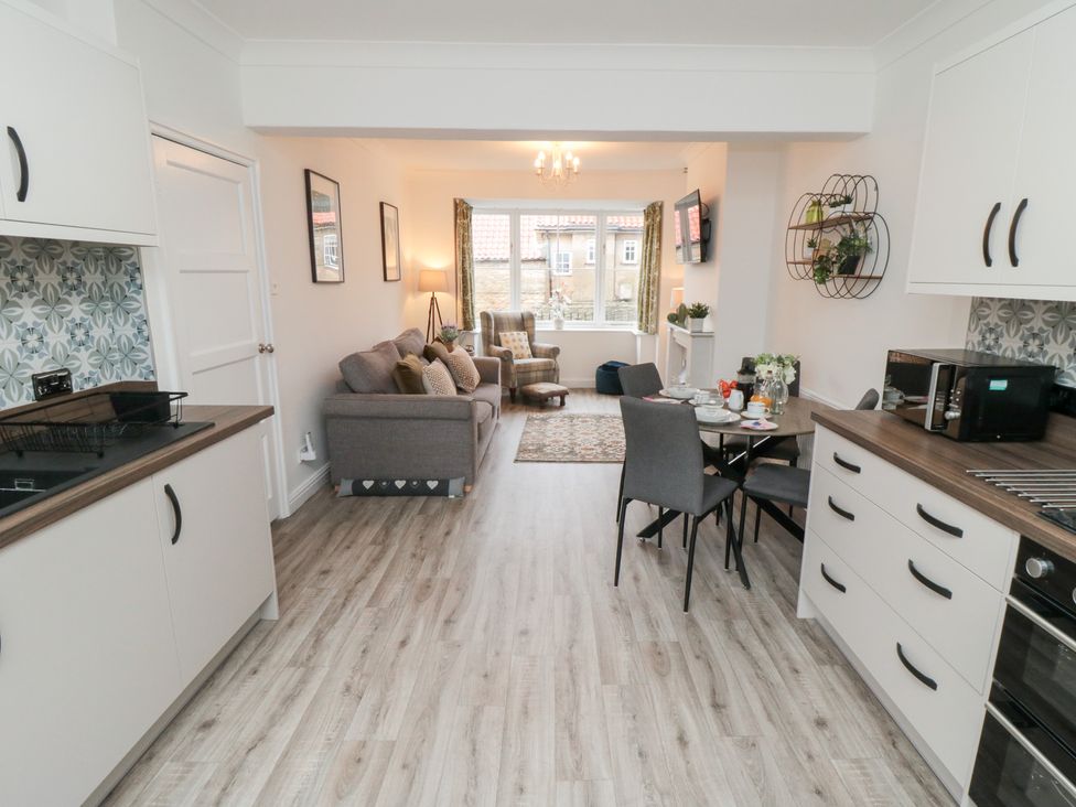 A kitchen with a dining area and living space at The Old Chapel in Brompton-By-Sawdon