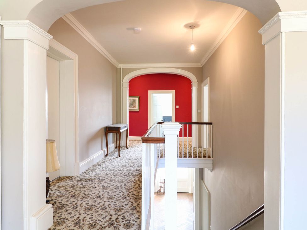 A staircase in a hallway at Bardon Hill Manor in Coalville