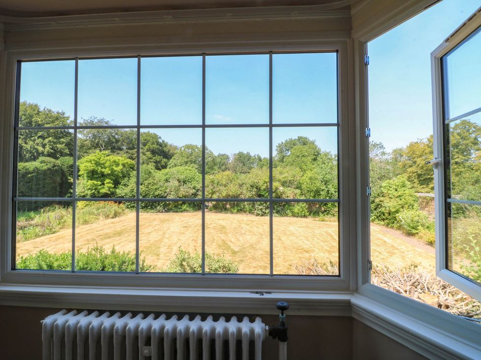 A window with a view of a garden at Bardon Hill Manor in Coalville