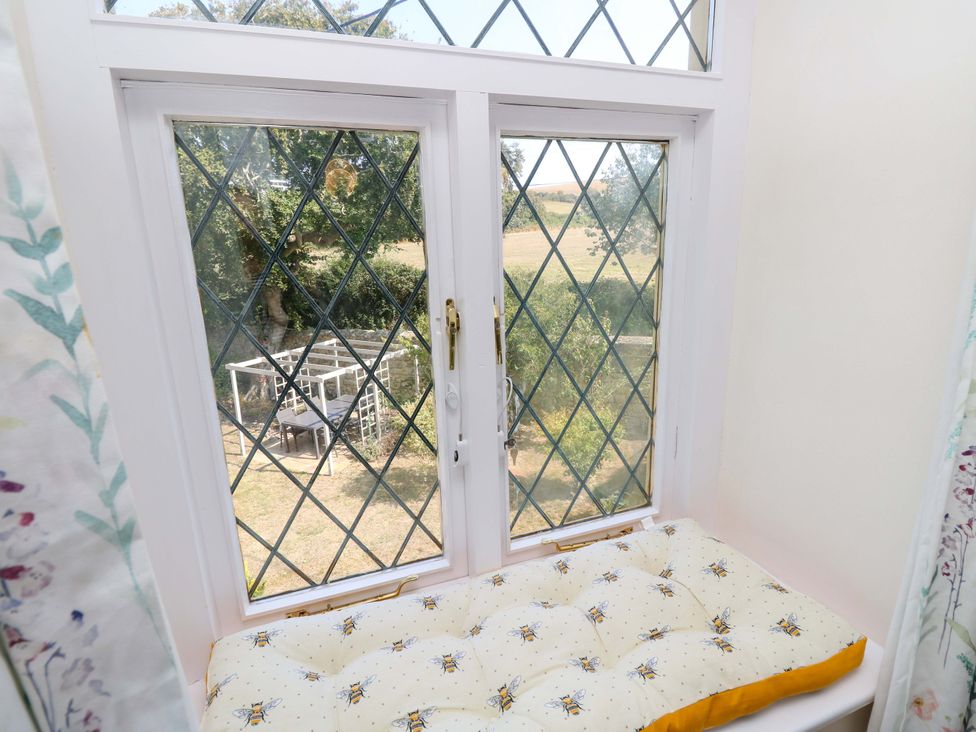 A window with a cushion seat at Glebe Garth in Chale near Niton