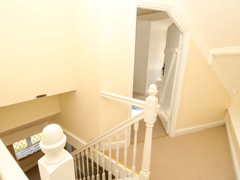 A staircase leading to a hallway at Glebe Garth in Chale near Niton