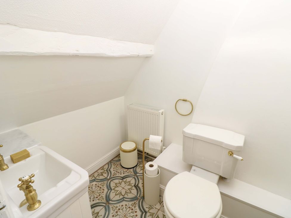 A bathroom with a sink and toilet at Glebe Garth in Chale near Niton