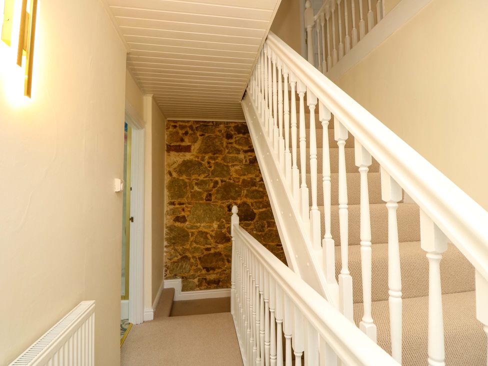A staircase leading to upper floors at Glebe Garth in Chale near Niton