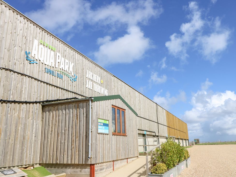 An Aqua Park building with signage and windows at Glebe Garth in Chale near Niton