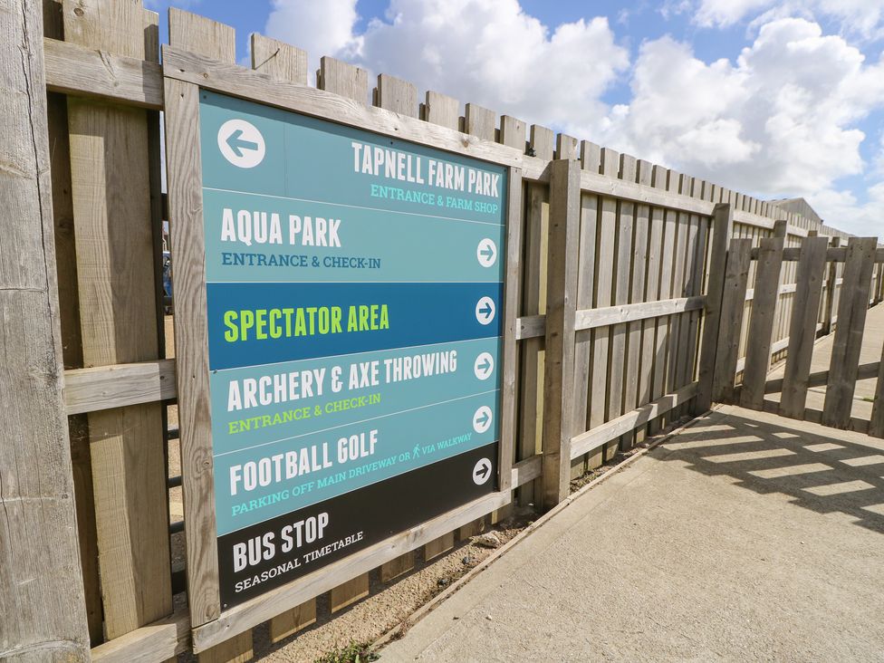 A signboard showing attractions and directions at Tapnell Farm Park in Chale near Niton