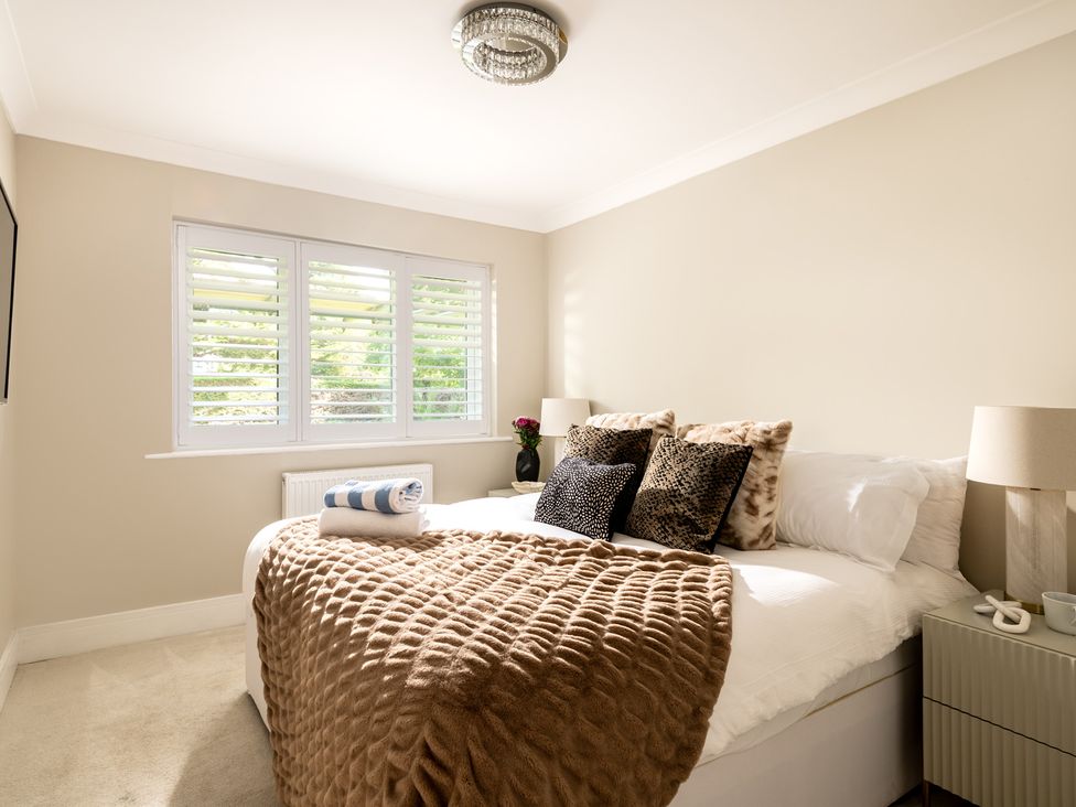 A bedroom with a bed and nightstand at Seaheaven 