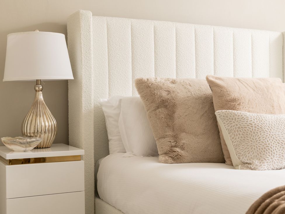A bedroom with a bed and nightstand at Seaheaven