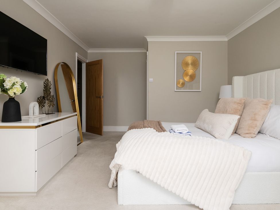 A bedroom with a bed and nightstand at Seaheaven