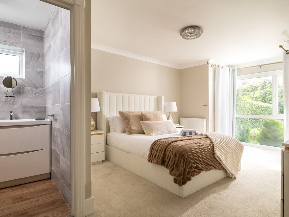 A bedroom with a bed and a bathroom at Seaheaven