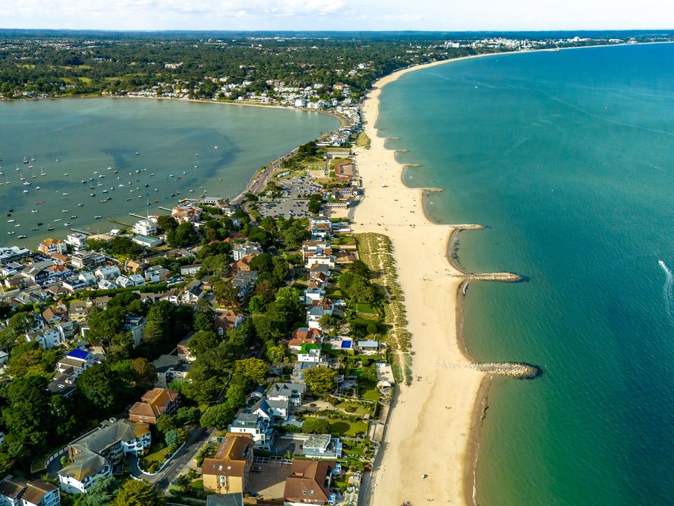 An aerial view of a beach with houses and boats at Seaheaven