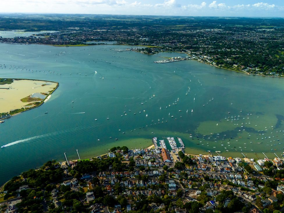An aerial view of a river with boats and a marina at Seaheaven