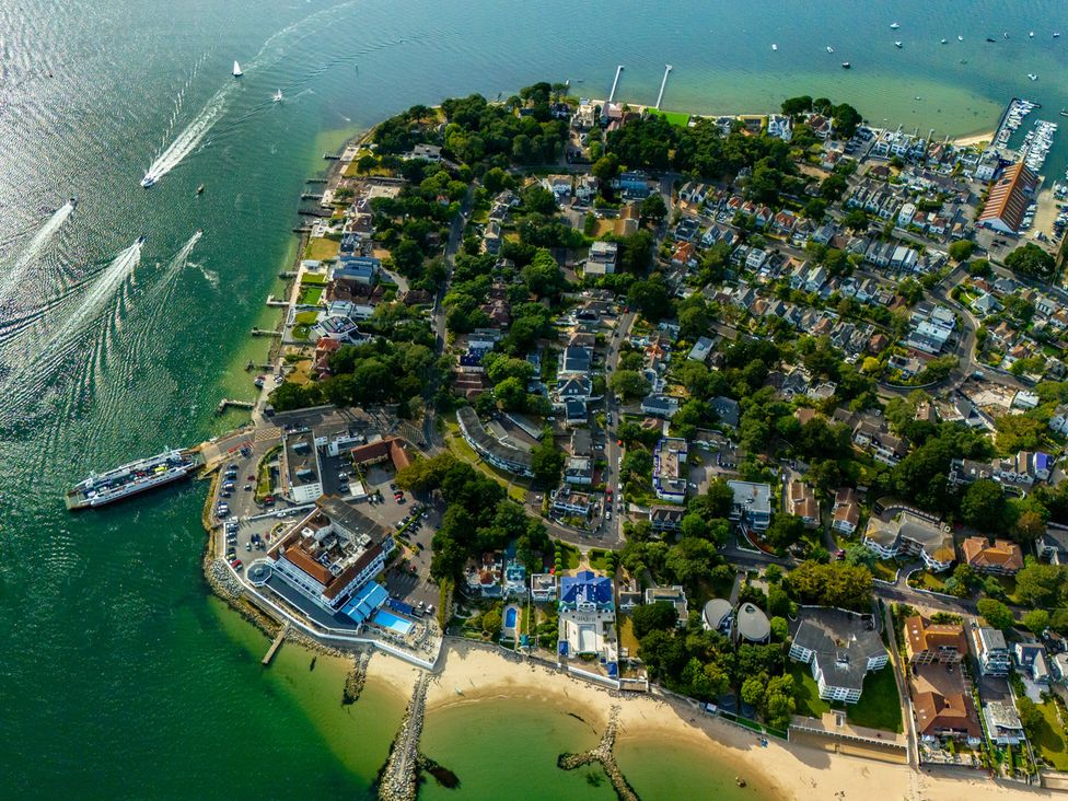 An aerial view of a coastal area with houses and boats at Seaheaven