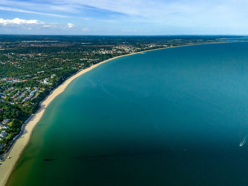 An aerial view of a beach and coastline with water at Seaheaven