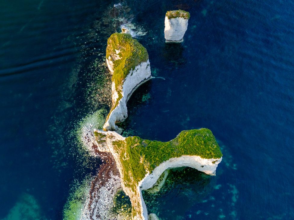 Aerial view of rock formations in the sea at Seaheaven