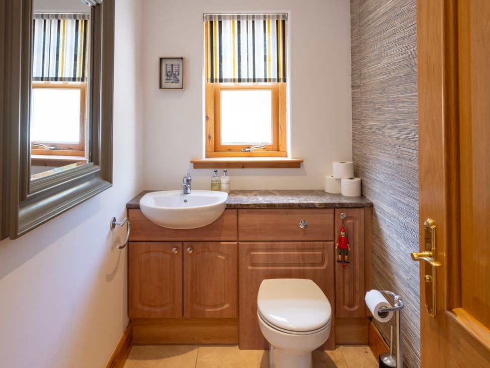 A bathroom with a sink and toilet at Old Distillery Lodge