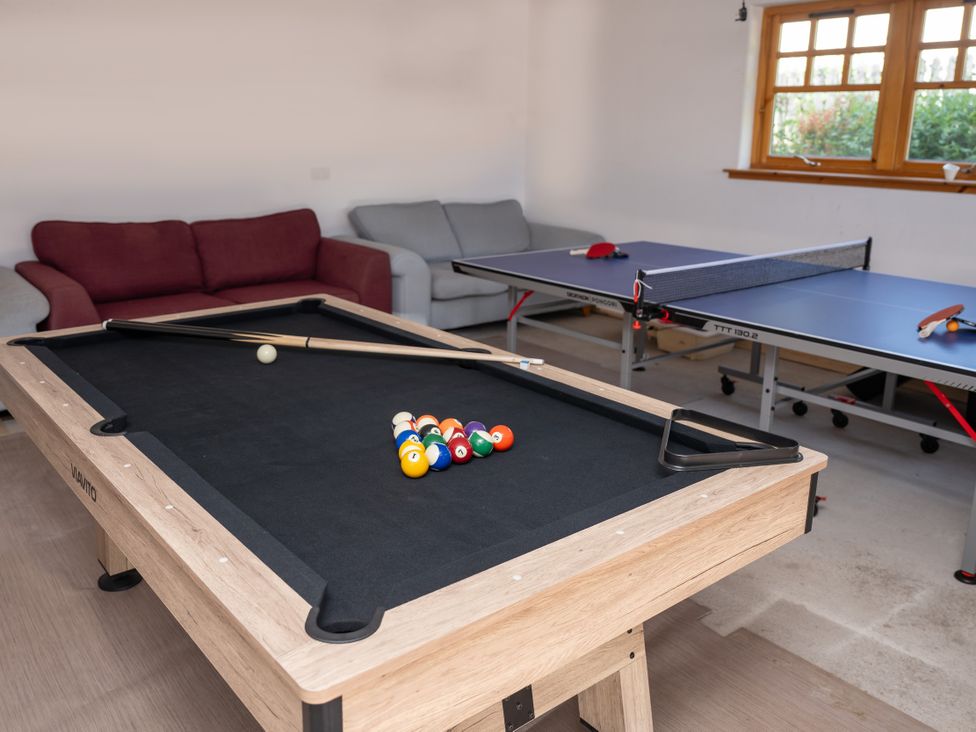 A game room with a pool table and a table tennis table at Old Distillery Lodge
