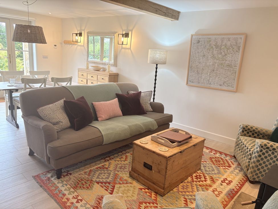A living room with a sofa and coffee table at Angram Cottage Angram Grange near Thirsk