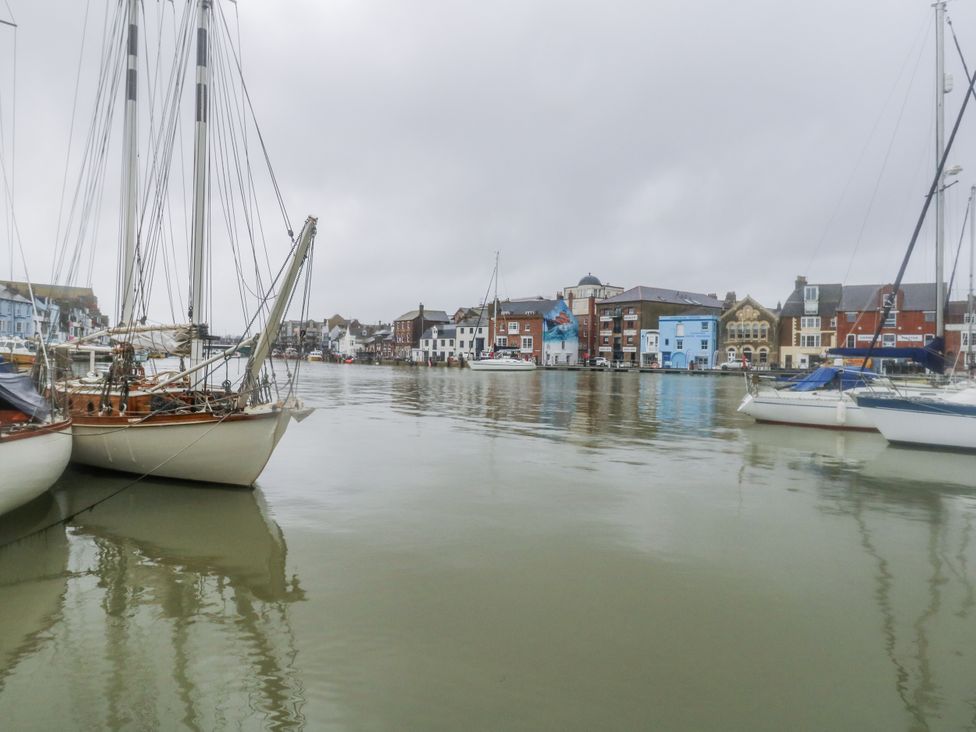 A view of sailboats docked in a harbor at Harbourside in Weymouth