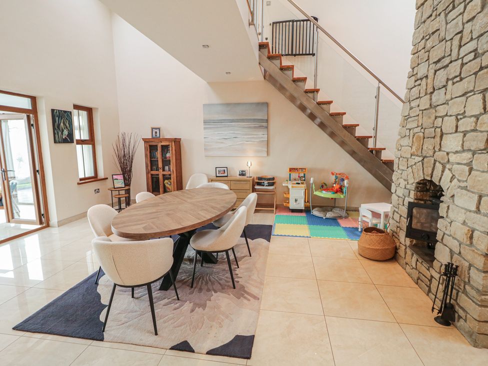 A dining room with a table and chairs at Ard Na Mara in Drung near Quigley's Point, County Donegal