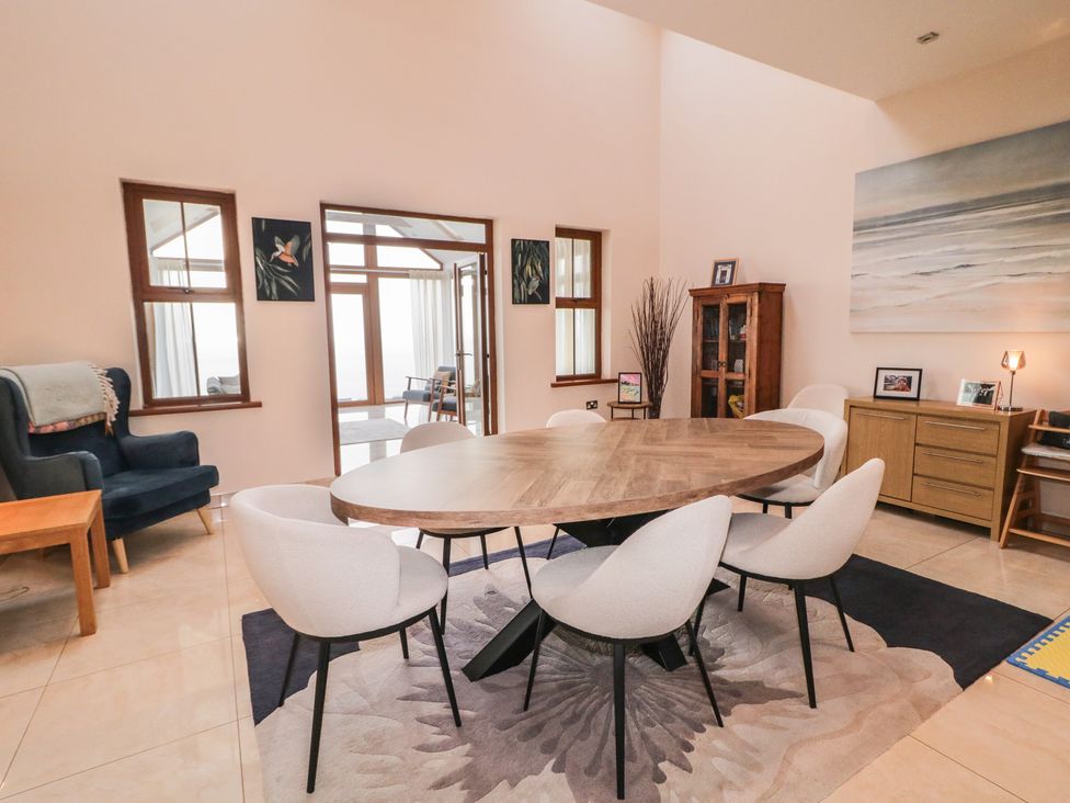 A dining room with a table and chairs at Ard Na Mara Drung near Quigley's Point County Donegal