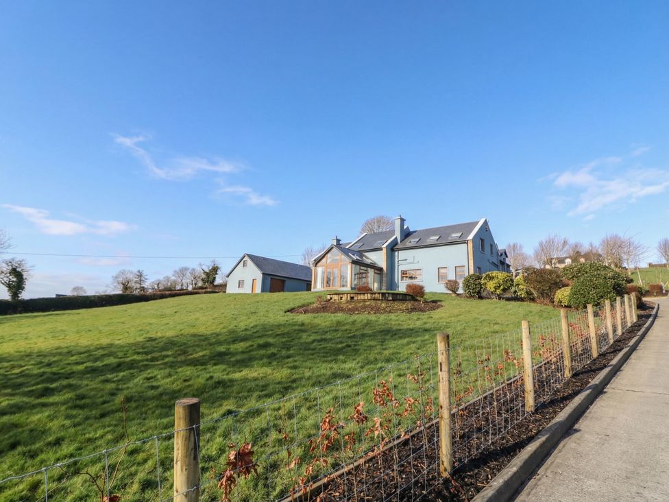 An outdoor view of a house with a garden at Ard Na Mara in Drung near Quigley's Point, County Donegal