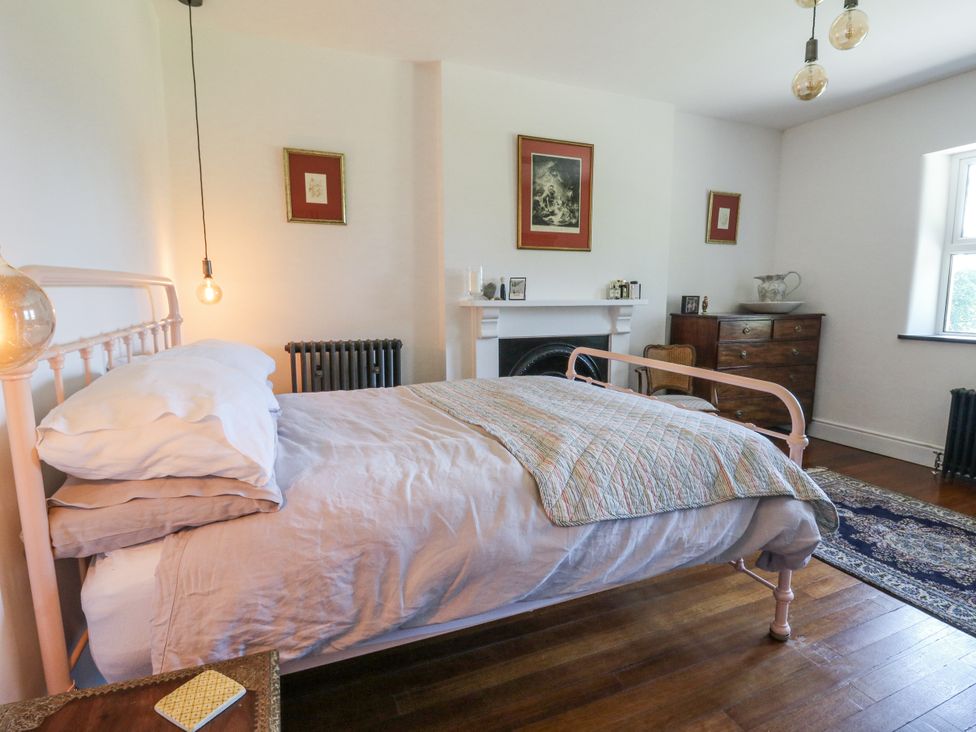 A bedroom with a bed and decorative elements at Glanrannell Park House Llanwrda
