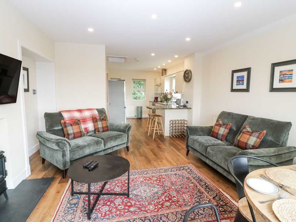 A living room with sofas and a coffee table at Top Cottage in Cupar, Fife