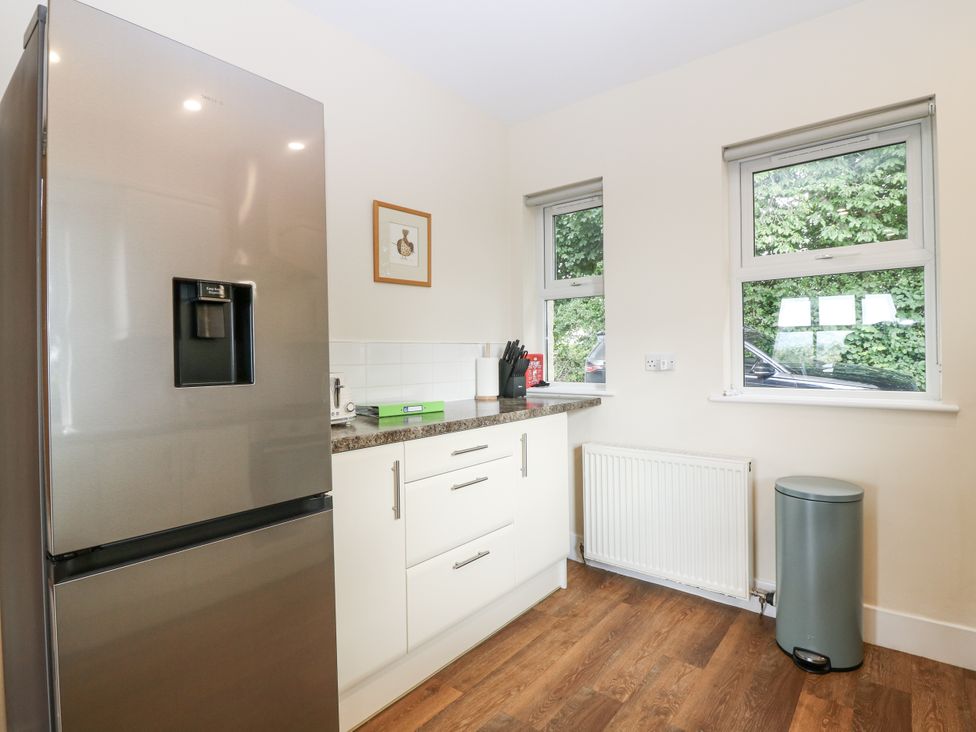A kitchen with a refrigerator and countertop at Top Cottage in Cupar, Fife