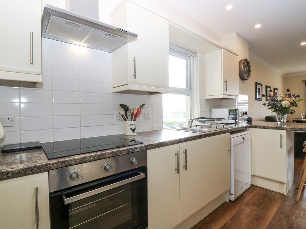 A kitchen with a cooker and utensils at Top Cottage in Cupar, Fife