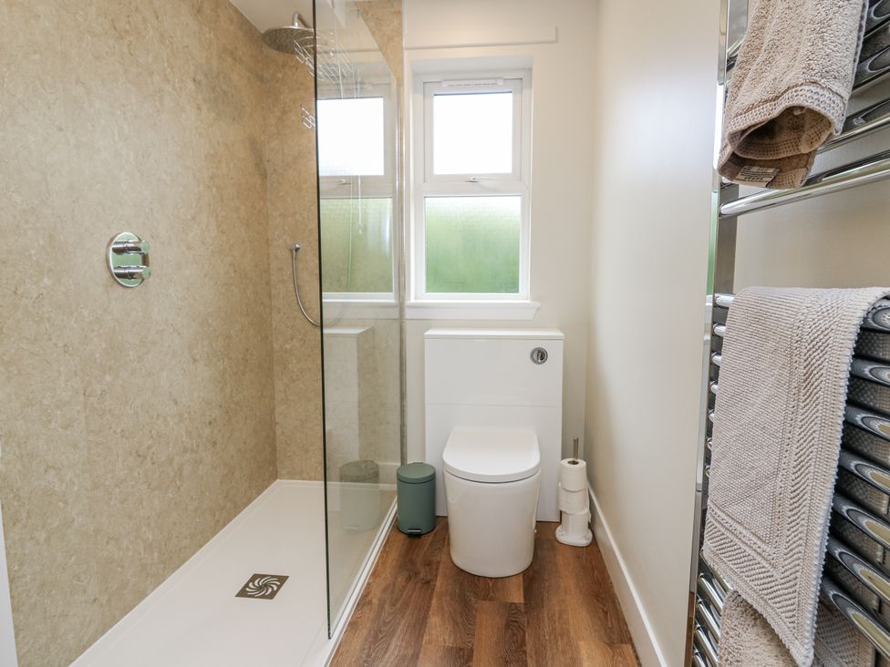 A bathroom with a shower and toilet at Top Cottage in Cupar, Fife