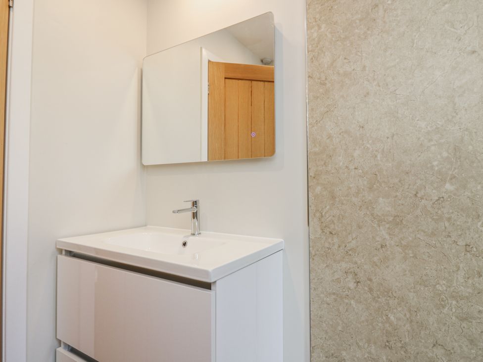 A bathroom with a sink and mirror at Top Cottage, Cupar, Fife