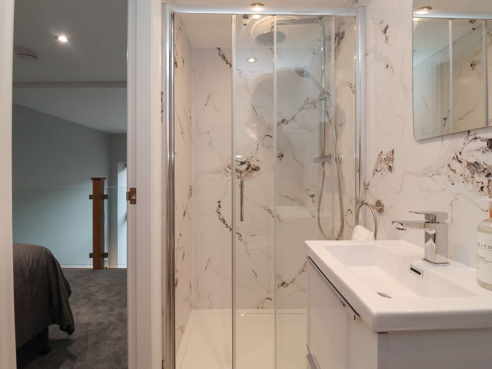 A bathroom with a shower and sink at Canal Side in Skipton