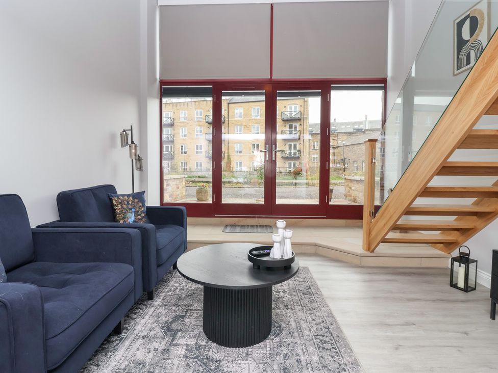 A living room with a sofa and coffee table at Canal Side in Skipton