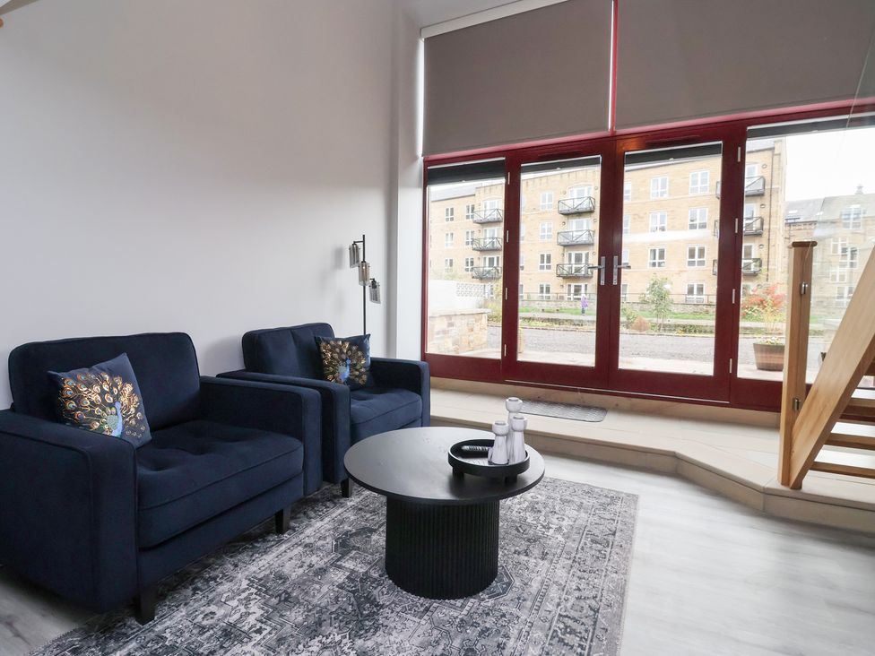 A living room with two sofas and a coffee table at Canal Side in Skipton