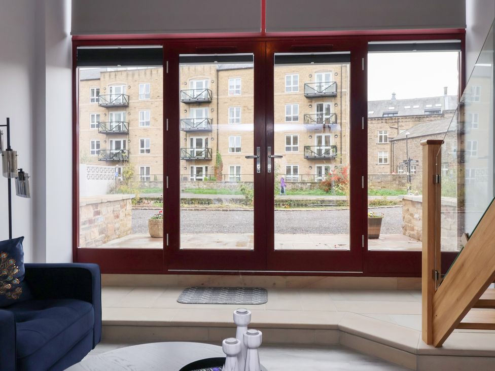 A view from inside looking at a building with balconies at Canal Side in Skipton