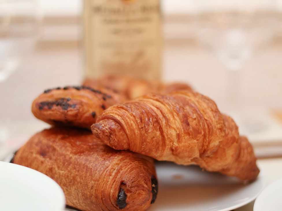 A plate with croissants and pastries at Wayside Farm Dairy Cottage Cloughton near Burniston