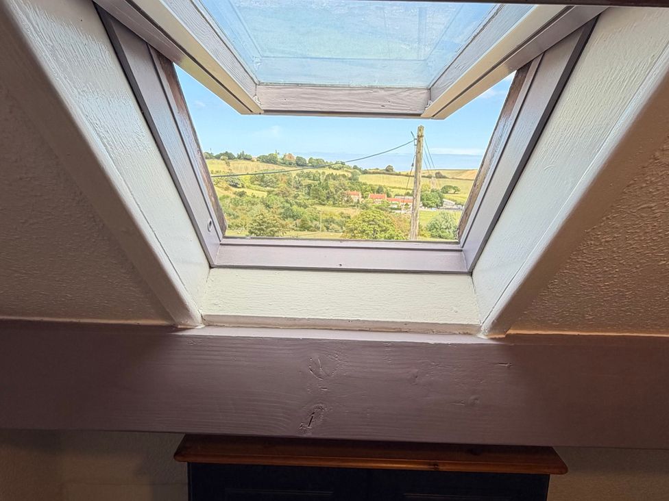 A window with a view of the countryside at Wayside Farm Cart Cottage Cloughton near Burniston