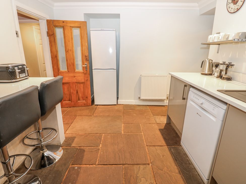 A kitchen with appliances and counter space at Mill Race House in Alston