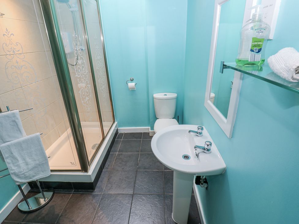 A bathroom with shower and sink at Mill Race House in Alston