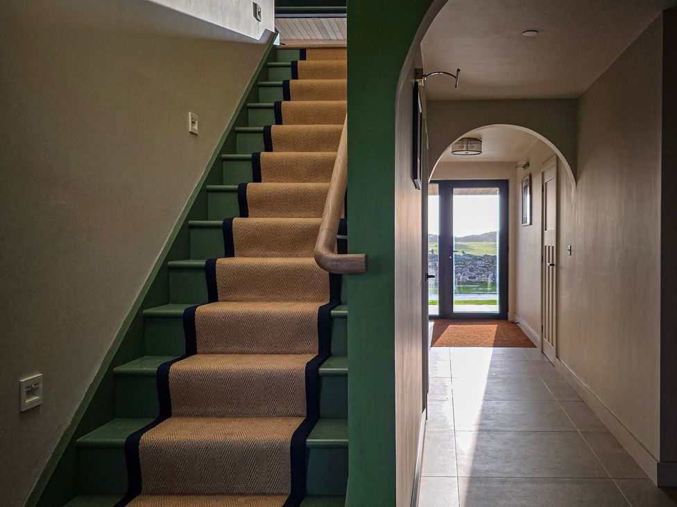 A staircase and hallway at Twyn Isaf in Borth