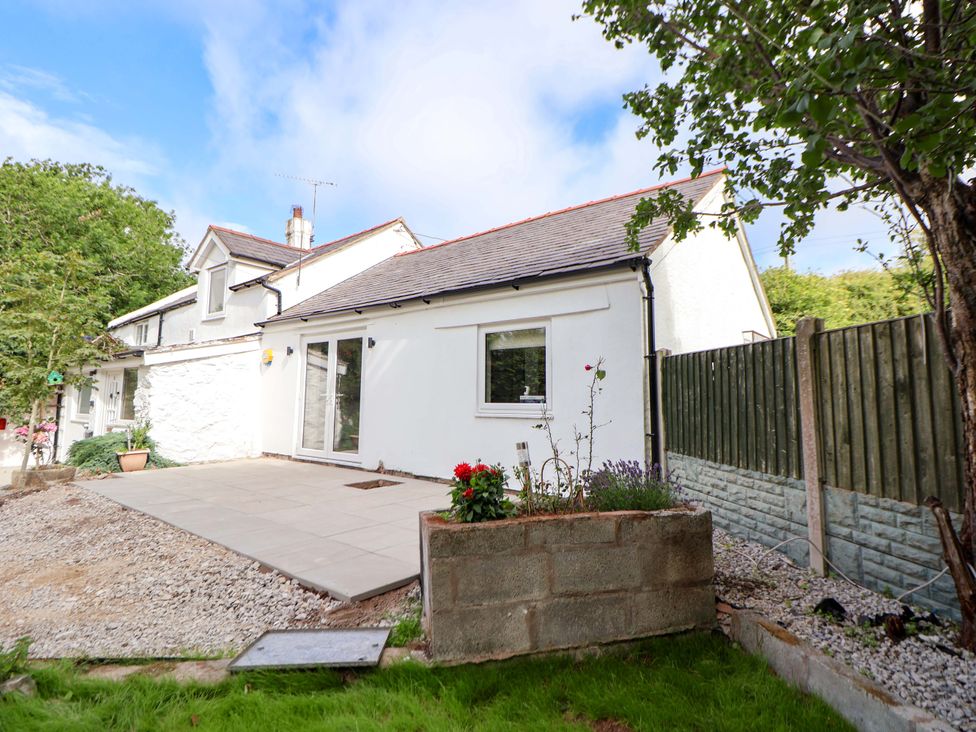 An outdoor area with a house and garden features at Cartref Pen Y Ball near Holywell