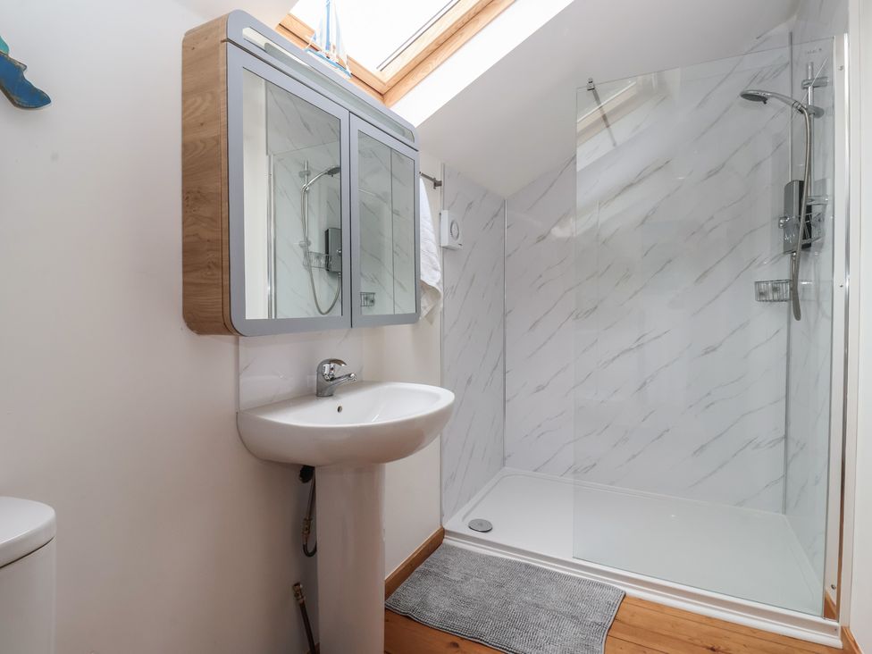 A bathroom with a shower and sink at The Old Vicarage Annex in Hornsea
