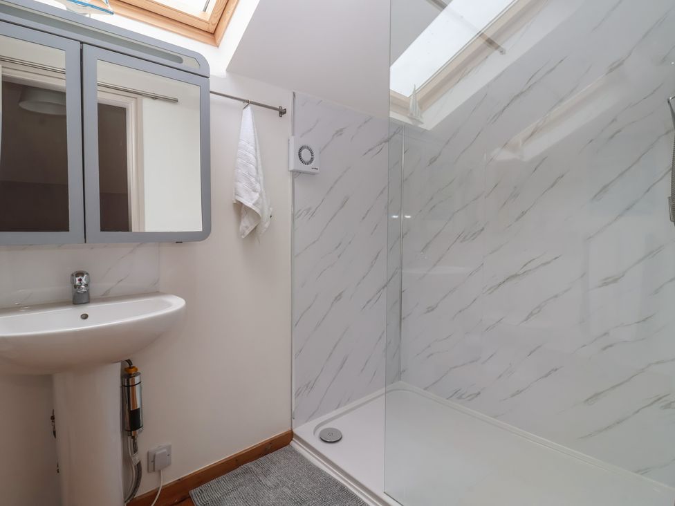 A bathroom with a shower and sink at The Old Vicarage Annex in Hornsea