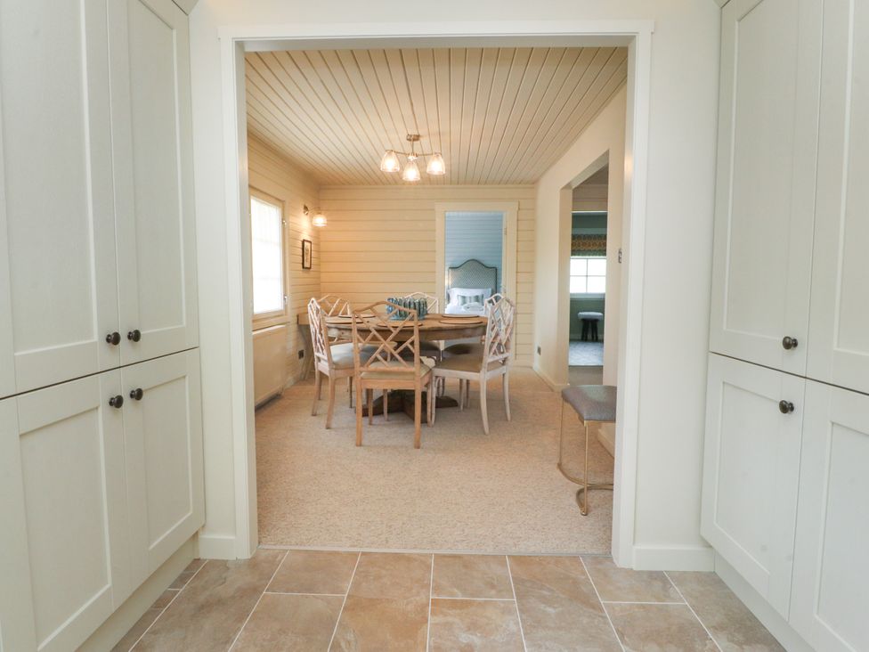 A dining room with a table and chairs at Manor Lodge in Clitheroe