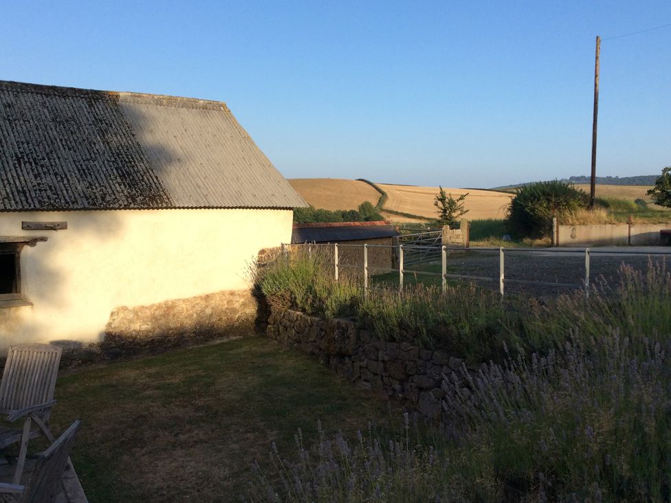 An outdoor area with a building and garden at Westacombe Farm, Dunsford near Tedburn St Mary