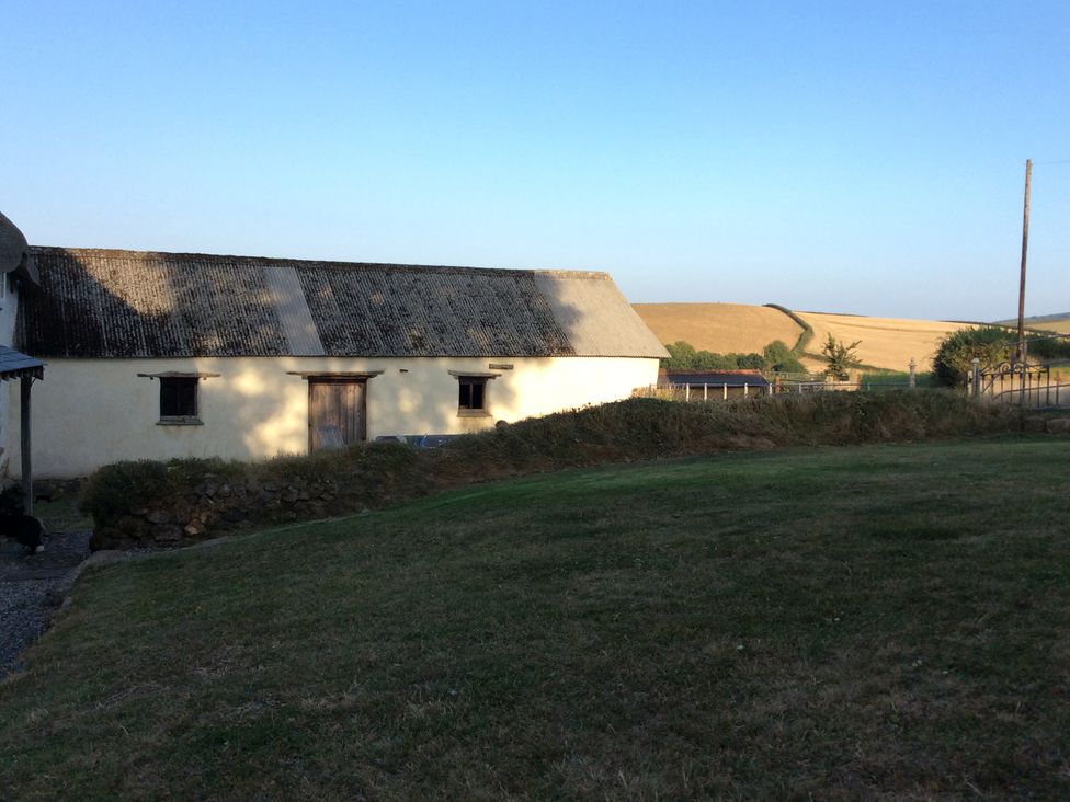 A building with windows and a door outside at Westacombe Farm in Dunsford near Tedburn St Mary