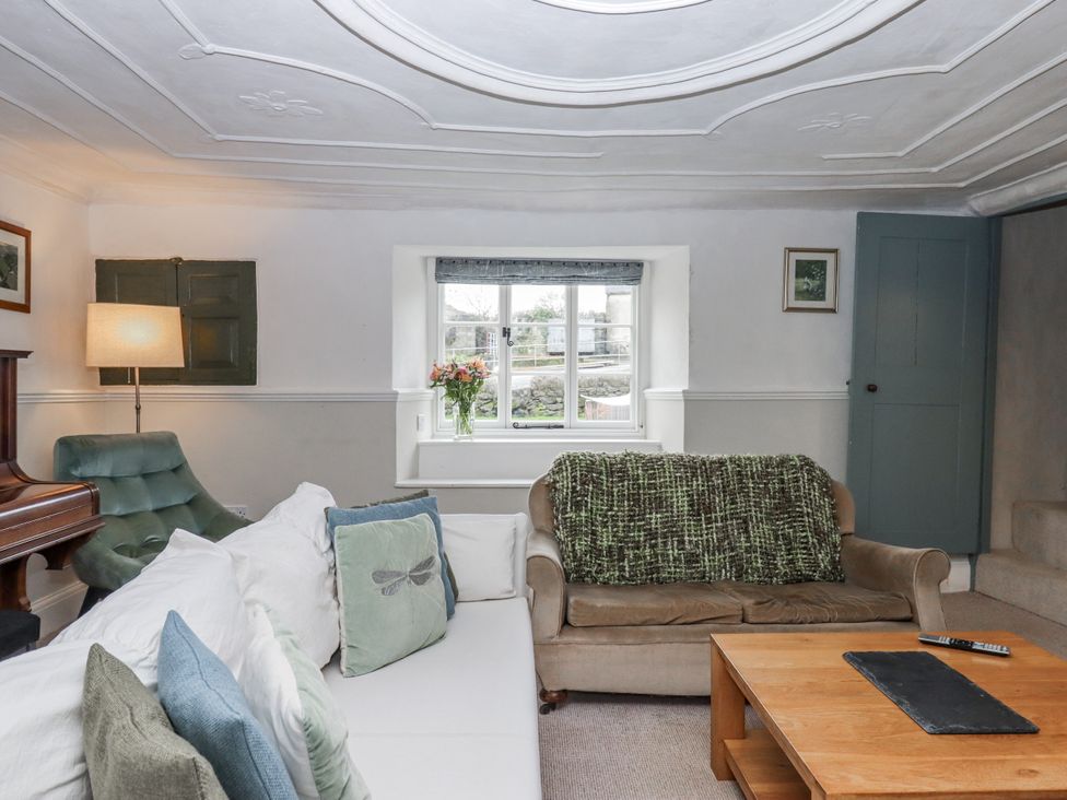 A living room with a sofa and a coffee table at Westacombe Farm in Dunsford