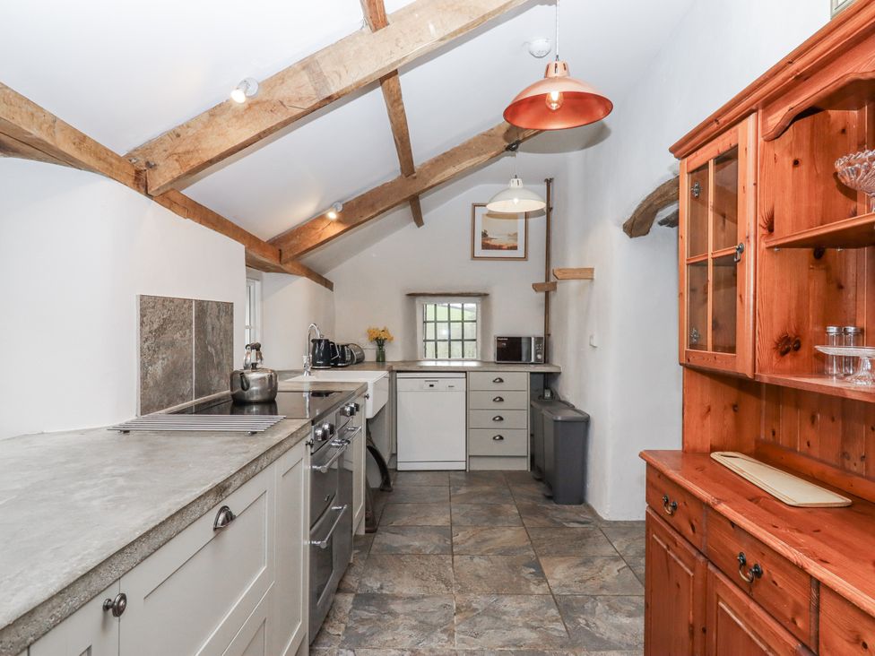 A kitchen with cabinets and appliances at Westacombe Farm in Dunsford