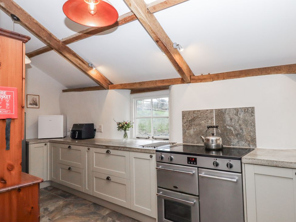 A kitchen with appliances at Westacombe Farm in Dunsford